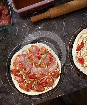 Harvesting pizza with bacon on table