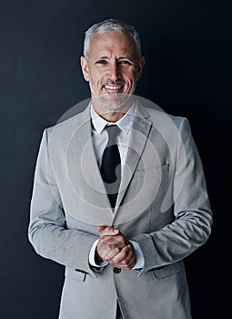 He has everything youd want in someone running your company. Studio portrait of a mature businessman against a dark