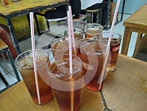 Has a habit in Indonesia, after eating, namely drinking with warm or cold tea water, Picture taken with High Angel. ?