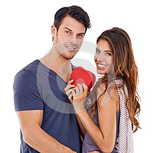 She has always had my heart. Studio portrait of a loving young couple holding a heart isolated on white.