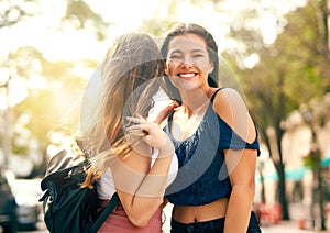 She has a way of always making me laugh. two female best friends hanging out in the city.