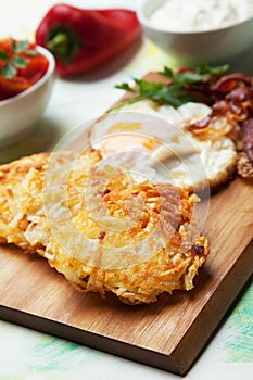 Hash browns with egg and bacon