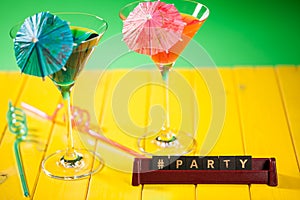 Hashtag party title word text with fun beach cocktail glasses