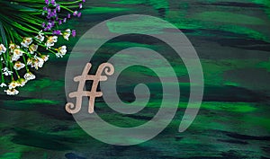 Hashtag Tagging Symbol made with Wooden letter on Hand painted Canvas. photo