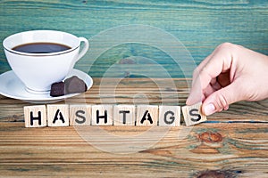 Hashtags. Wooden letters on the office desk, informative and communication background