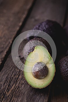 Hass avocado in a basket on a wooden table