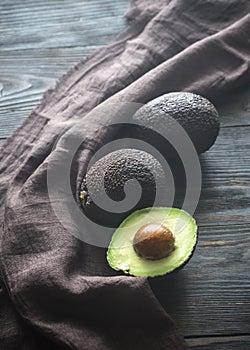 Hass avocados on the wooden background