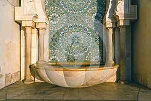 Hassan II Mosque fountain made of mosaic tile work , Detail of Hassan II Mosque at sunset in Casablanca, Morocco