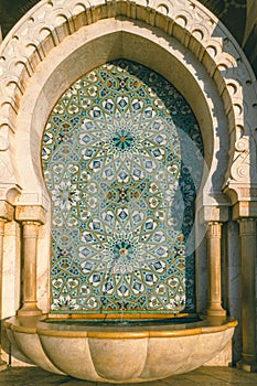 Hassan II Mosque fountain made of mosaic tile work , Detail of Hassan II Mosque at sunset in Casablanca, Morocco