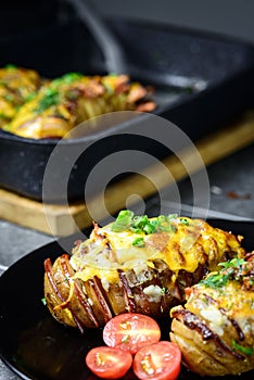 Hasselback potatoes with meat and herbs