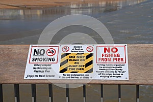 Hastings pier warning sign photo