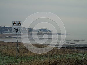 Hastings seafront view with warning sign