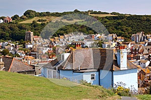 HASTINGS, UK: General view of Hastings old town from West Hill with green hills and the sea in the background