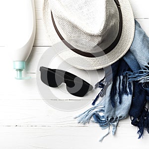 Hat and blue scarf with sunglasses