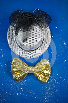 Hat and bow tie, blue background, party, carnival, New Year`s