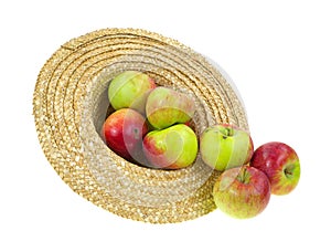 Hat filled with spilling apples