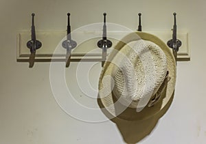 hat hanging on the wall