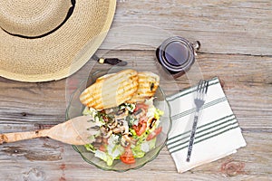 Hat and Healthy Lunch on Wooden Background