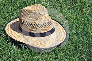 Hat on the lawn background