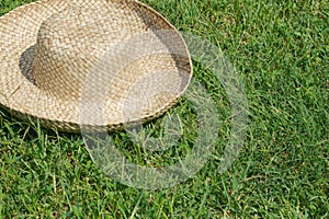 Hat on the lawn background