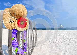 Hat and Lei on Fence