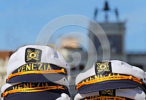 hat for sailors with VENICE written and the ClockTower two bronze statues