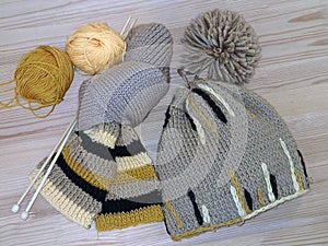 Hat, scarf, yarn and knitting needles