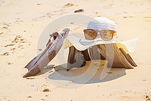 Hat and Sunglass on Timber the beach Relax Summer Vacation Holiday Concept Toned