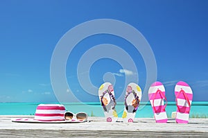 Hat, sunglasses and flip-flops