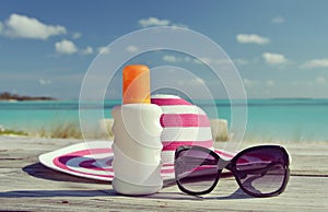 Hat, sunglasses and sun lotion