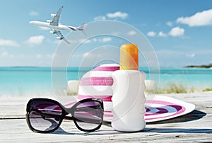 Hat, sunglasses and sun lotion