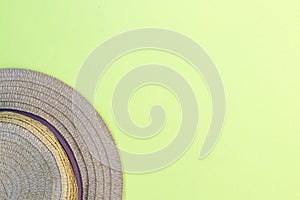 Hat on a yellow background, summer holidays mood, top view