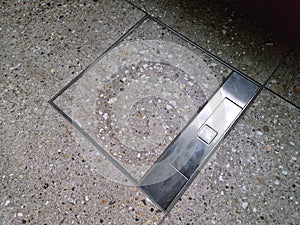 hatch in the floor hides the slots for connecting to the mains and