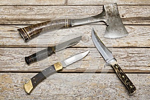 Hatchet hunting knives weathered background photo