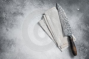 Hatchets for meat, Vintage butcher meat cleaver with cloth towel on wooden board. White background. Top view. Copy space