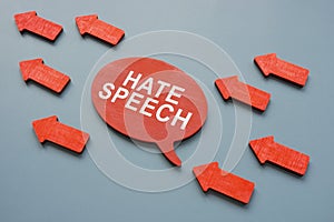 Hate speech concept. Red arrows and quote bubble. photo