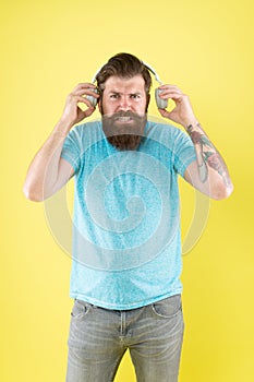 Hateful song. Music taste. Bearded guy dislike music. Irritating sound. Man listening music wireless headphones