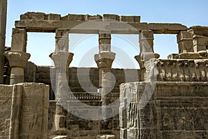 The Hathor capitals on the papyrus columns in the Temple of Nectanebo on Philae in Egypt.