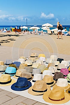 Hats on sale at La Barceloneta beach in Barcelona, Spain photo
