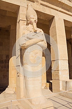 Hatshepsut as pharaoh in Osiris holding seen from the right hand side