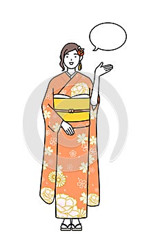 Hatsumode at New Year\'s and graduation ceremonies, weddings, etc, Woman in furisode giving directions,