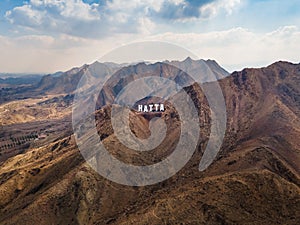 Hatta city sign in Hajar mountains in Hatta enclave of Dubai in the UAE