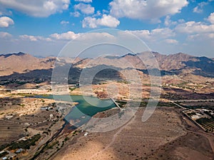 Hatta town aerial cityscape surrounded by Hajar mountains in Hatta enclave of Dubai in the UAE