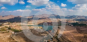 Hatta town aerial cityscape surrounded by Hajar mountains in Hatta enclave of Dubai in the UAE