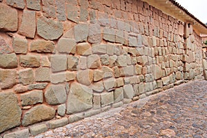 Hatun Rumiyoc street with Incan twelve angle stone in Cusco, Peru