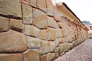 Hatun Rumiyoc street with Incan twelve angle stone in Cusco, Peru