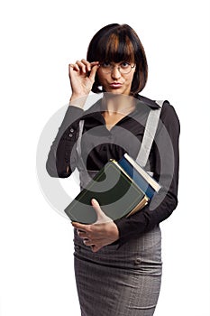 Haughty brunette schoolgirl hold books in the hand