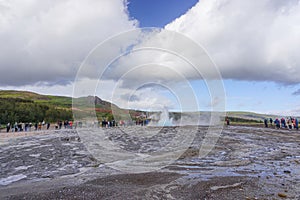 Haukadalur, Iceland: Visitors watch as the active Strokkur geyser erupts