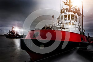 Haulier ships in an harbor in the evening composition