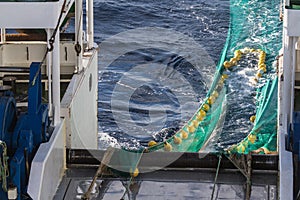 Hauling otter trawl fishing nets